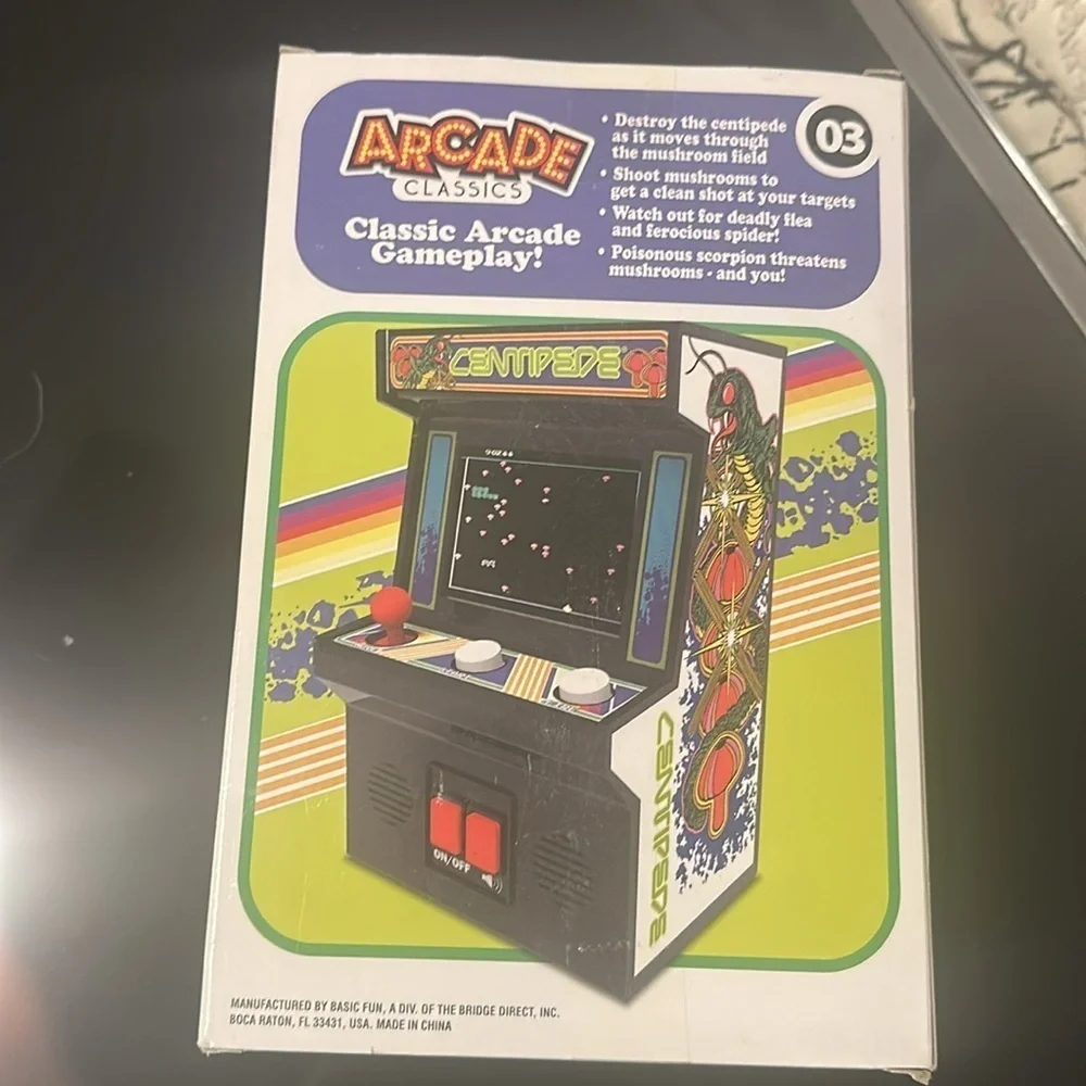 Arcade Classics Centipede hand held game.